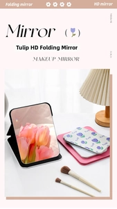 Close-up of folding HD makeup mirror featuring floral tulip patterns and adjustable stand