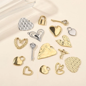 Polished heart and key stainless steel pendants with rhinestones in gold and silver finish