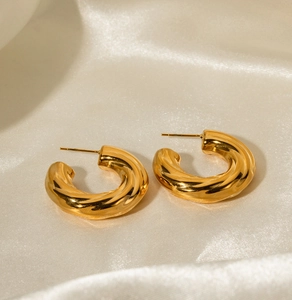 Polished 18K gold plated hollow C-shape earrings with a stylish twisted texture design