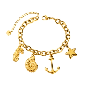 Detail of gold stainless steel bracelet with seahorse, shell, anchor and star charms