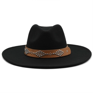 Detail of black wool fedora featuring a brown leather band with silver metal rivets