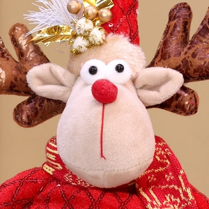 Close-up of plush Christmas reindeer ornament with red sequin hat and knitted scarf