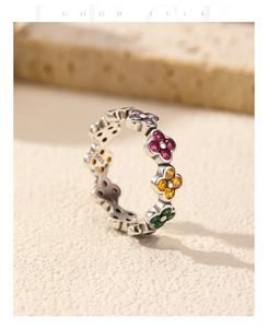 Macro view of S925 silver ring featuring colorful clover motifs and stone engravings