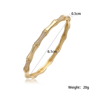 Detail shot of 18K gold plated bamboo cuff bangle with zircon inlays and dimensions