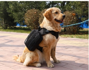 Detail view of the black tactical dog backpack with removable side pouch and nylon webbing