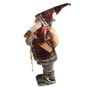 Detail of Santa Claus figurine with red plaid outfit, faux fur trim and wooden skis