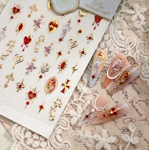 Detail of TL-406 nail stickers with baroque angels, gold crosses and red gems