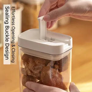Airtight food storage jar with white locking lid holding dried mushrooms in kitchen