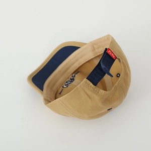 Detail of adjustable blue strap with DIE CUTE red label and gossip embroidery inside