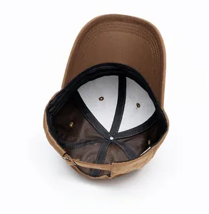 Detail showing the internal twill cotton structure and black reinforced seams of a baseball cap