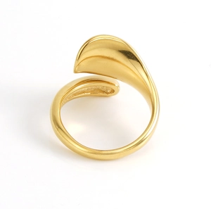 Detail of minimalist 18k gold plated stainless steel open ring with smooth curved surface