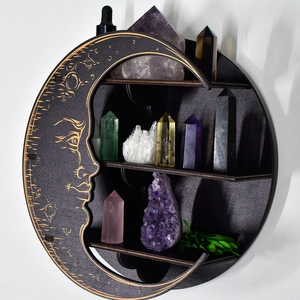 Detailed view of crescent moon shaped wooden wall shelf with three tiers and carvings
