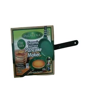 Green non-stick double-sided pancake maker with ergonomic handle in retail packaging