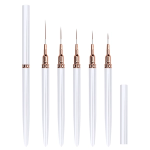 Détail de l'ensemble de 5 pinceaux liner nail art avec manches blancs et viroles or rose