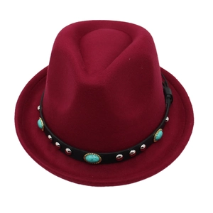 Detail of burgundy wool felt fedora featuring turquoise stones and silver rivets on leather