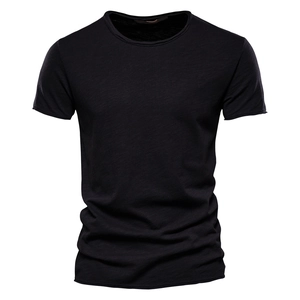 Detailed close-up of black slub cotton fabric texture on a men's V-neck T-shirt