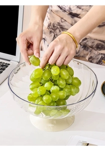 Close-up of elegant clear fruit bowl with swirl texture and cream base on desk