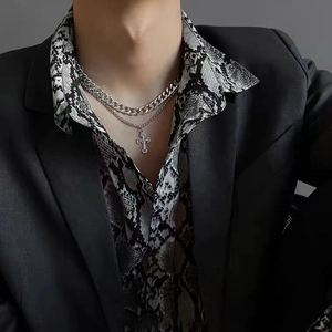 Double-layered silver titanium steel necklace featuring a cross pendant and Cuban link chain