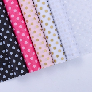 Polka dot tissue paper rolls for gift wrapping in black pink and white colors