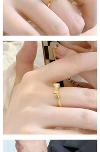 Macro detail of a thin gold bow ring for women featuring a minimalist knot design