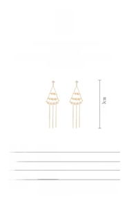 Detailed view of long gold tassel earrings with natural baroque pearls and S925 silver