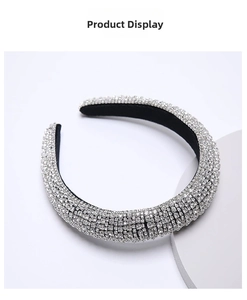 Detailed close-up of padded velvet headband with shiny white rhinestones and crystals