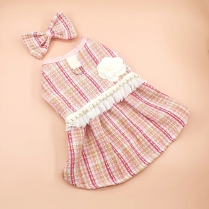 Pink tweed pet dress detail with white camellia flower and matching bow accessory