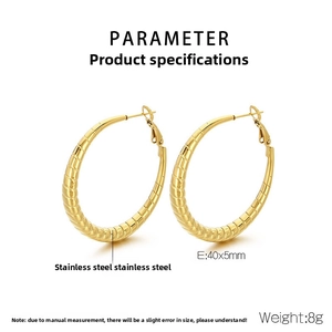 Macro view of 40x5mm gold stainless steel hoop earrings with spiral striped texture