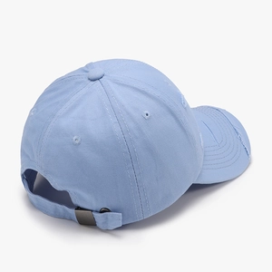 Distressed light blue cotton baseball cap with adjustable metal strap and ripped details