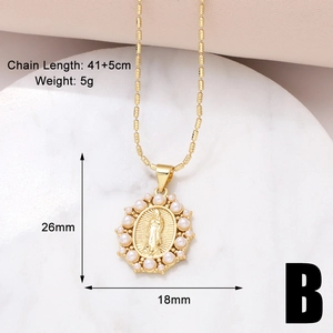 Close-up of Virgin Mary gold pendant with pearl border, dimensions 26mm by 18mm