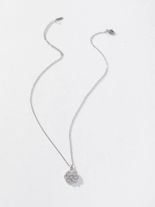 Close-up of silver sunflower pendant necklace with zircon stones and lobster clasp detail