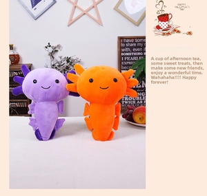 Detail of purple and orange axolotl plush toys with embroidered facial features