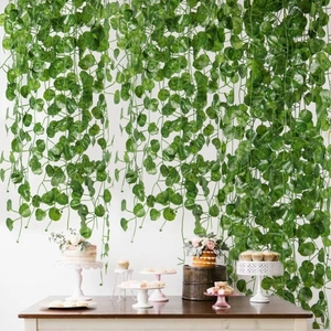 Artificial 2M ivy garlands hanging over a festive wooden table for home decor