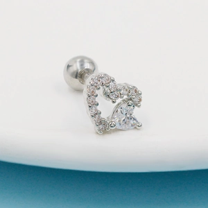 Macro shot of silver heart cartilage stud with cubic zirconia and screw back
