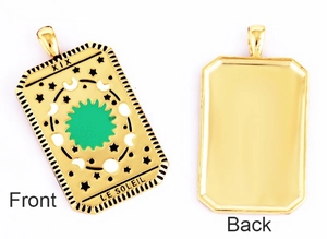 Front and back view of gold-plated tarot pendant with sun design and XIX engraving