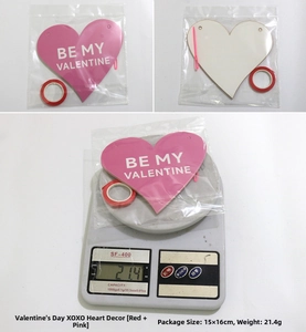 Detail of glitter heart garland with BE MY VALENTINE text and red ribbon