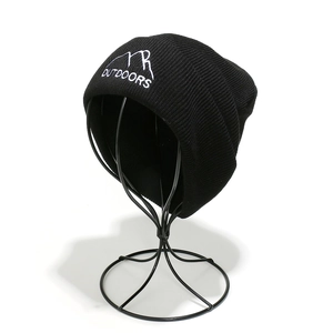 Close-up of Outdoors mountain peak embroidery on black ribbed knit beanie for men
