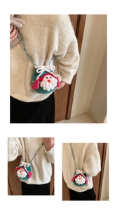 Detail of handmade crochet Christmas bag with 3D Santa Claus and green knit texture