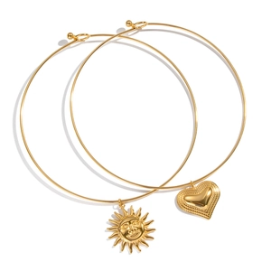 18K gold plated titanium sun and heart pendant bangles set on white background