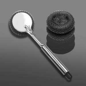 Long handle stainless steel kitchen brush with wire ball head on reflective dark background