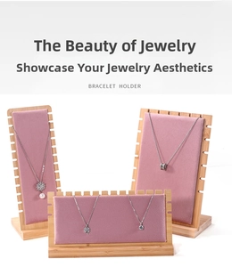 Pink velvet jewelry display stands for necklaces and bracelets with wooden base