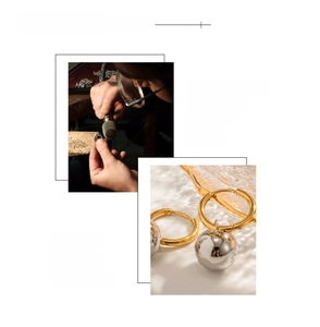 Macro detail of 18K gold plated hoop and silver ball pendant with vacuum plating finish