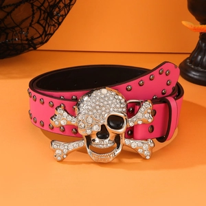 Punk style rose red leather belt with silver skull buckle and metal studs on orange background