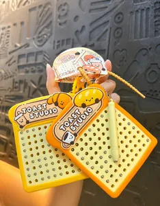 Close-up of toast shaped magnetic drawing board keychain with stylus for kids