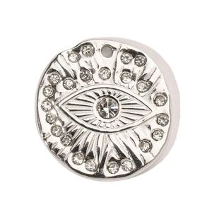 Macro view of silver stainless steel evil eye pendant with white rhinestones
