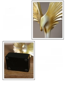 Detailed close-up of golden resin wing feathers and non-slip base of a modern ornament
