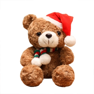 Brown Christmas teddy bear with red hat and striped scarf sitting on white background