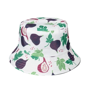 Reversible bucket hat with white background and vibrant purple fig and green leaf prints