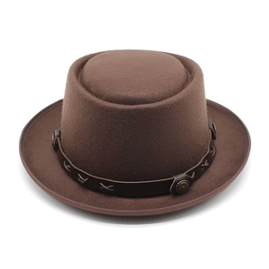 Detail of wool felt fedora with dark brown leather strap and metallic rivet hardware