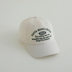 Detail of Santa Monica 1924 embroidery on breathable cream baseball cap mesh